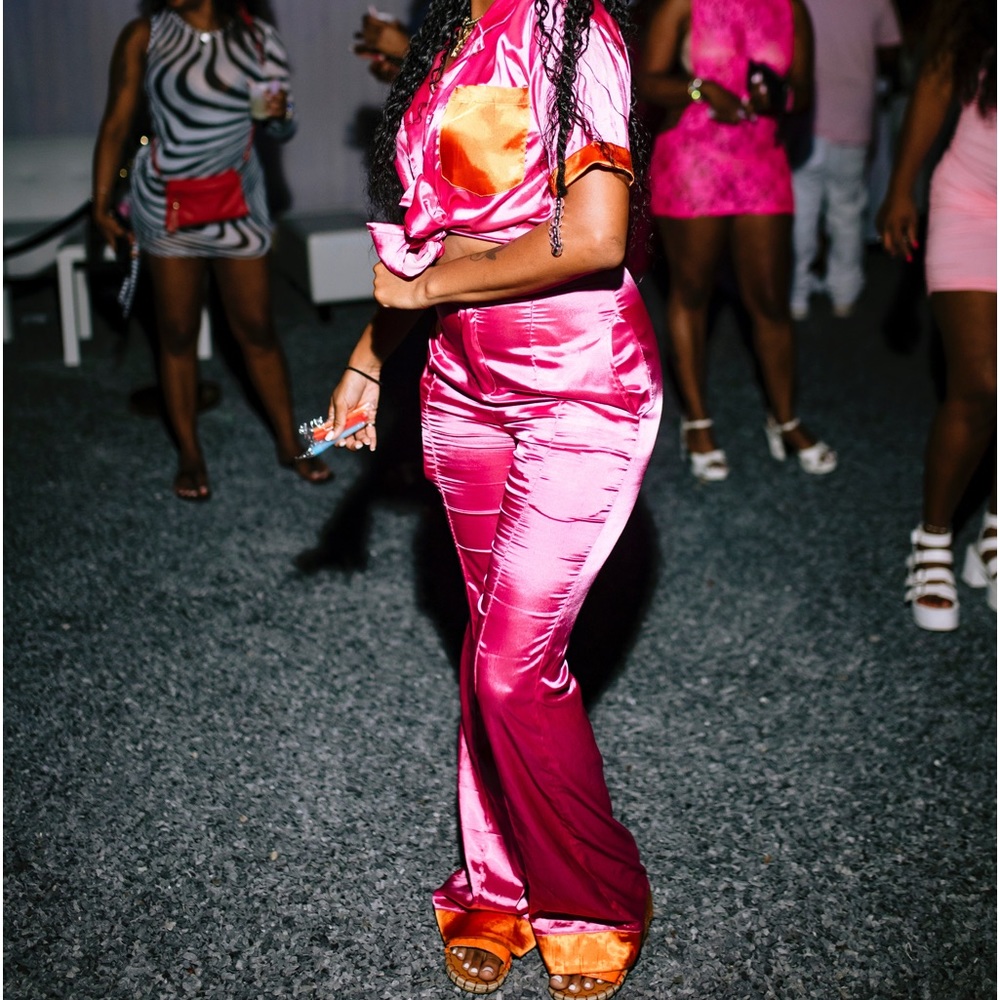 pink two piece set with orange details
